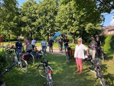 Group with wheels inspects playground