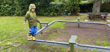 Arne tries out the new balancing seesaw.