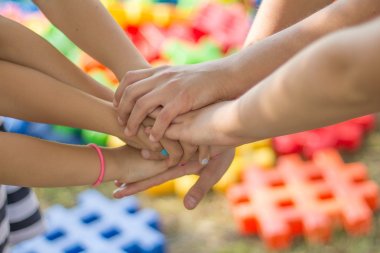 Children's hands form a net