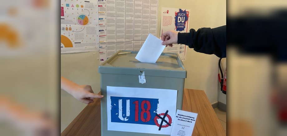 Hand on the ballot box