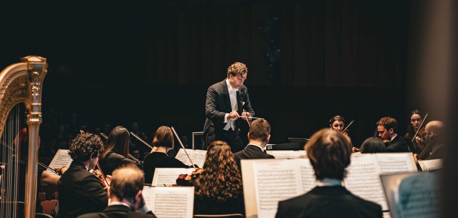 Conductor with orchestra