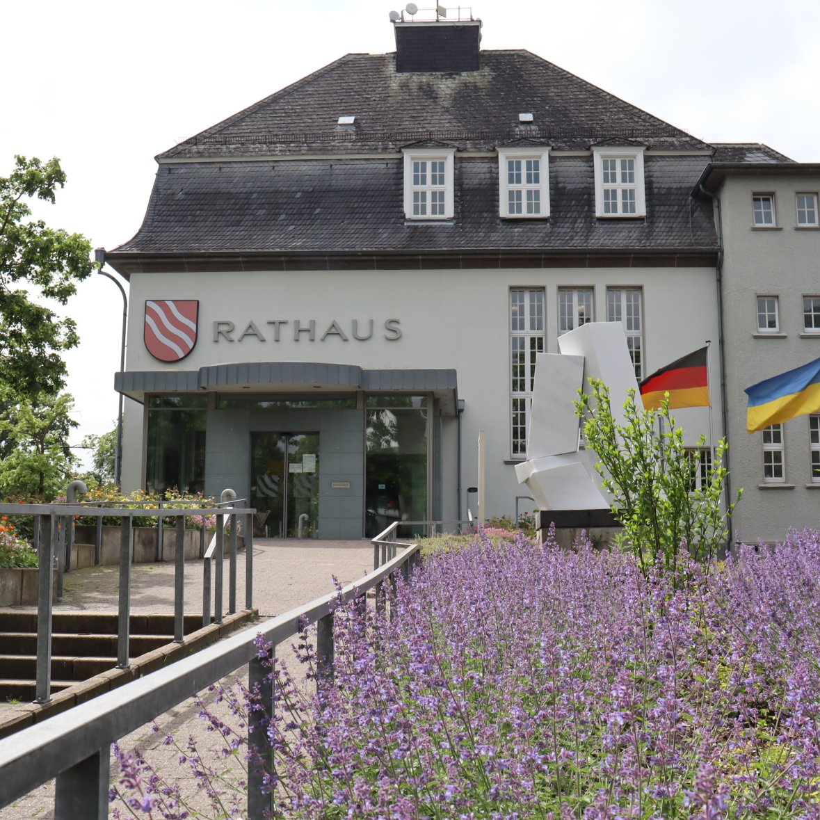 Town hall entrance with flowerbed